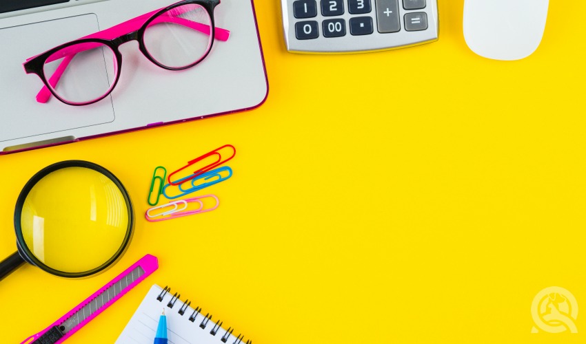 yellow desk with office supplies