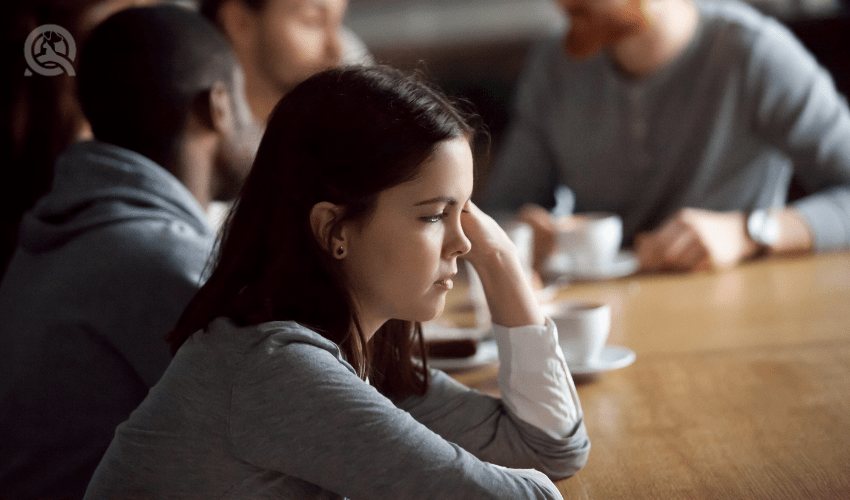 disengaged woman in work meeting