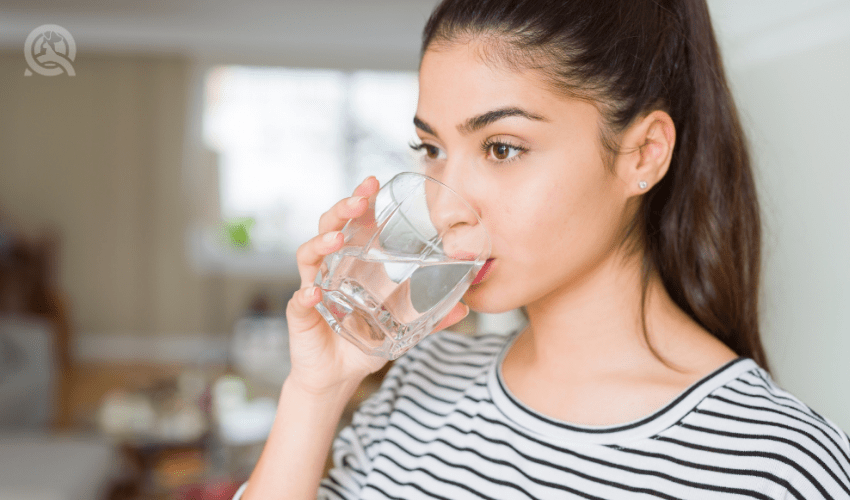 woman drinking glass of water